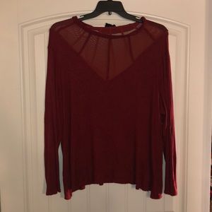 Long sleeve rust colored top with mesh detail
